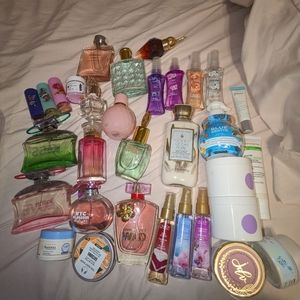 Twenty bottle of perfume with bonus lotions lip scrub
